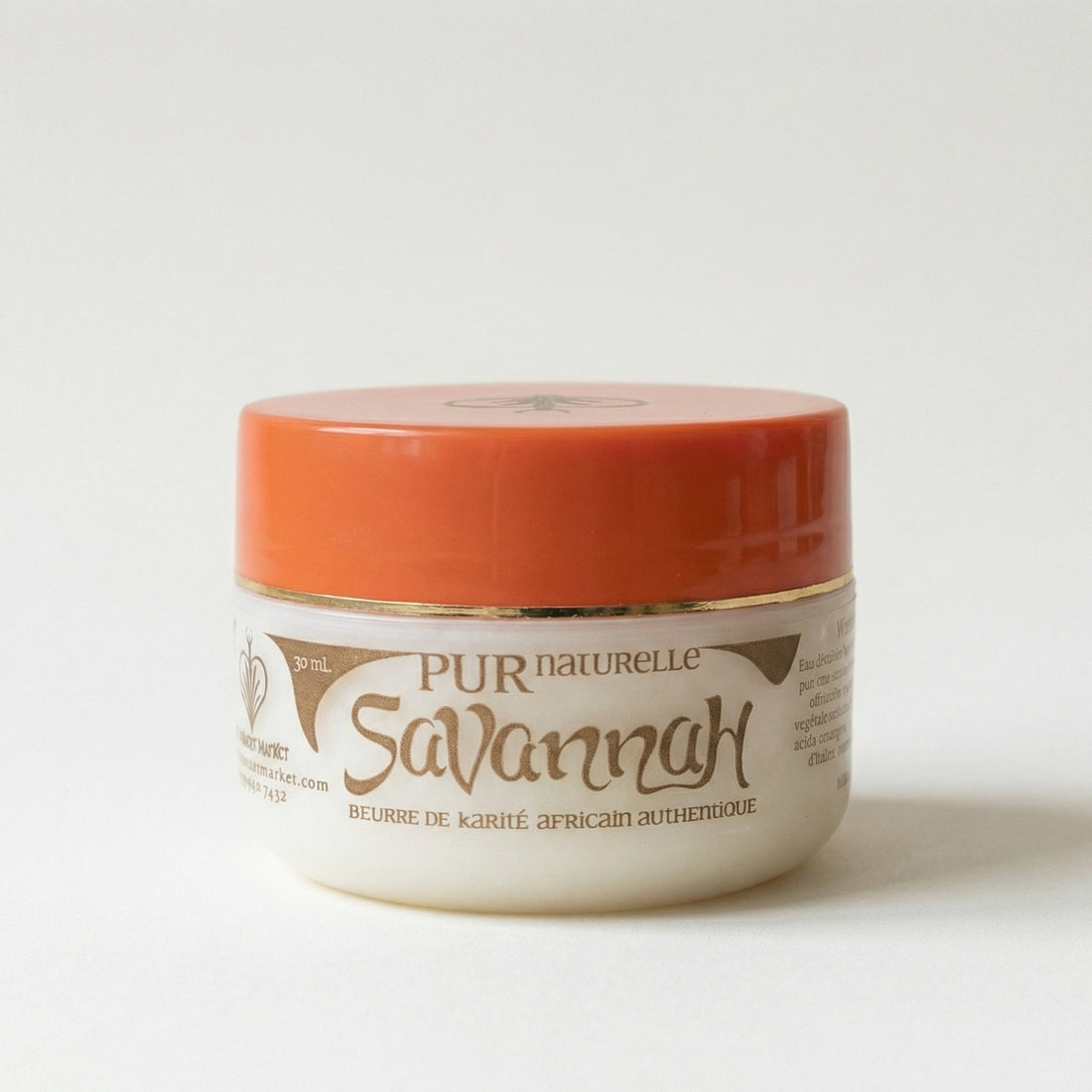 Jar of Savannah face cream with soft natural light